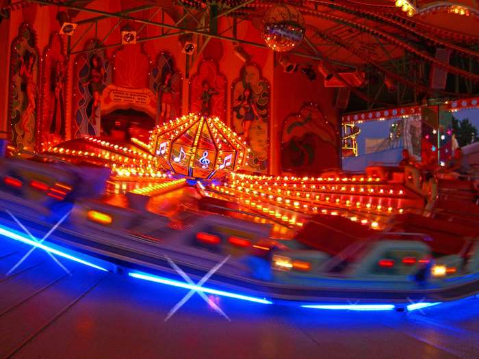 Carnival ride with music and lights at night