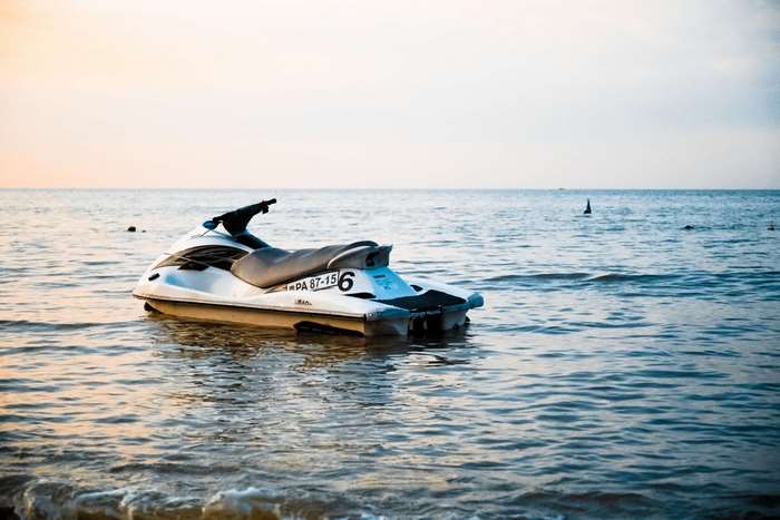 Jet ski on the water at sunset 4K