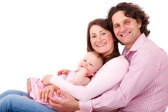 Family portrait of parents with baby daughter