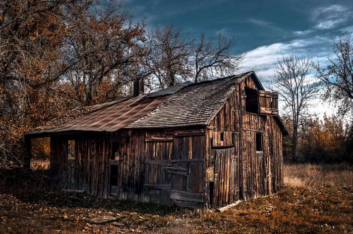 Abandoned wooden barn in autumn landscape, Colorado 4K
