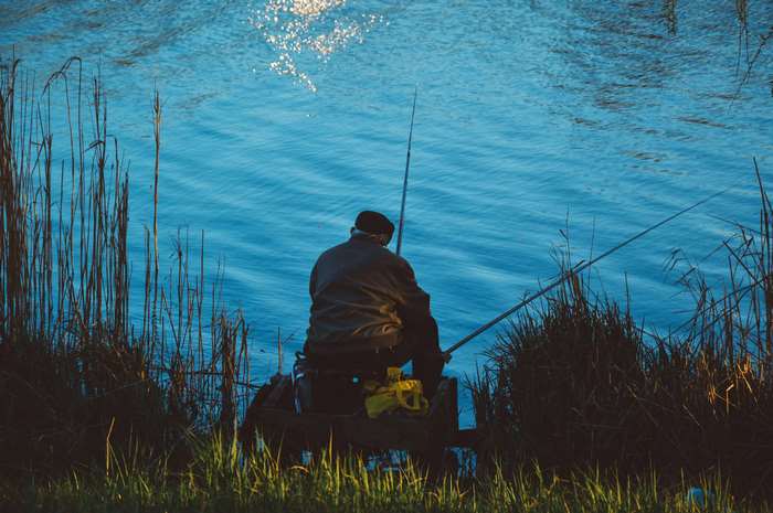 Man fishing by the water 4K