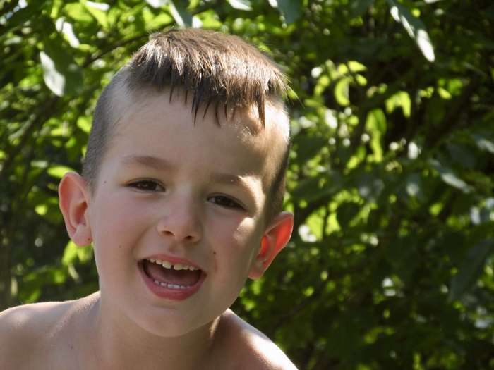 Boy smiling in nature