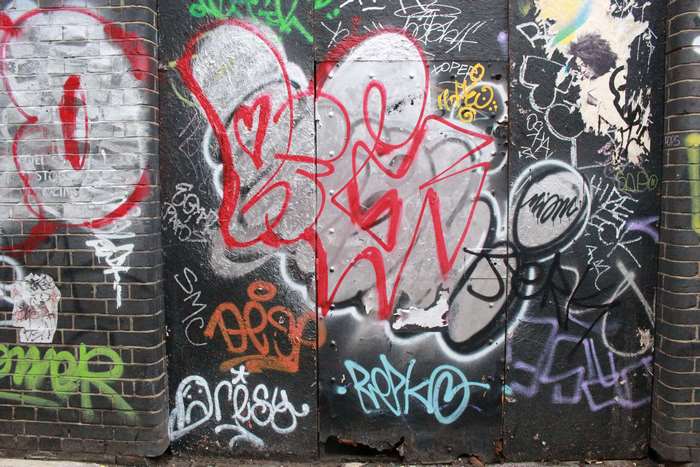 Graffiti art on brick and metal walls in Shoreditch, London 4K