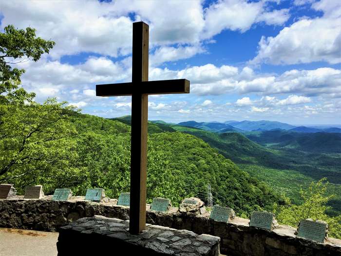 Cross overlooking mountains