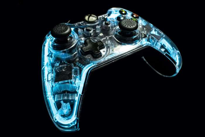 Transparent blue Xbox controller with neon lighting