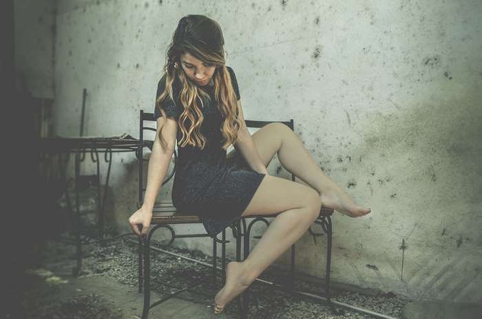Woman in Black Dress Sitting on Chair Artistic Photo