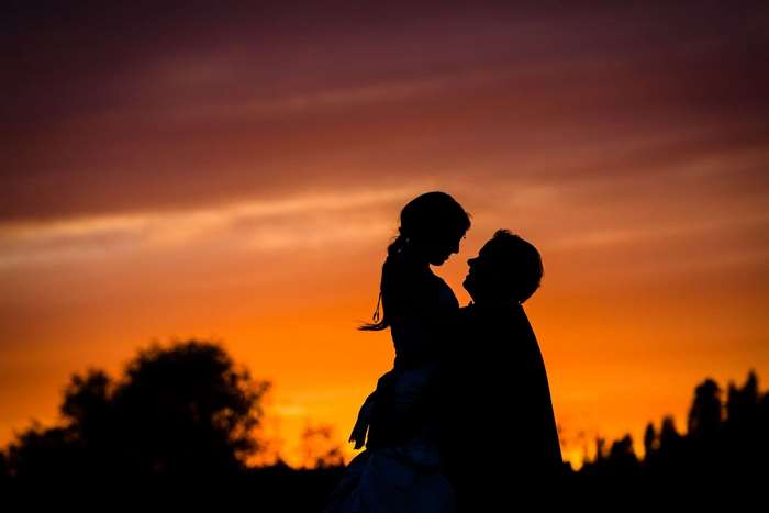 Couple in silhouette at sunset