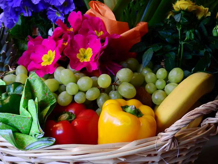 Fruit and flower basket with peppers and grapes