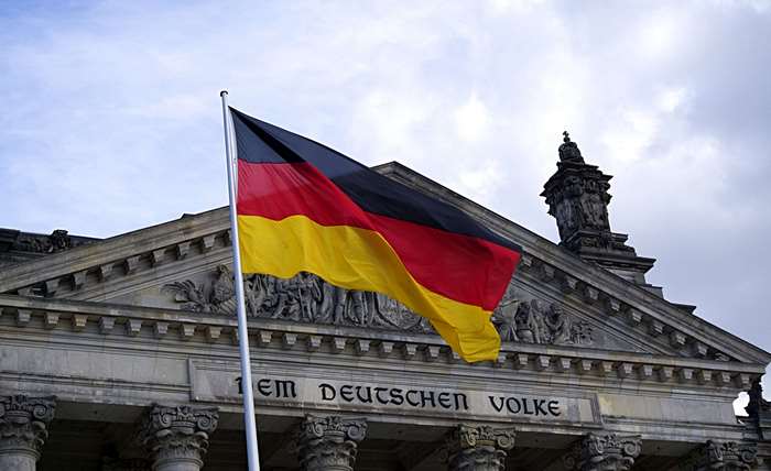German flag in front of the Reichstag building