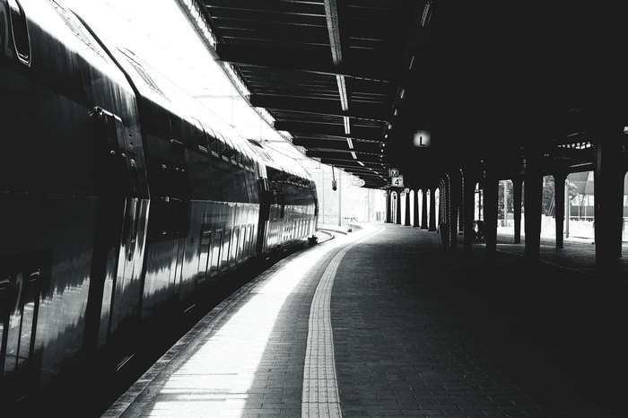 Train at a dark station platform