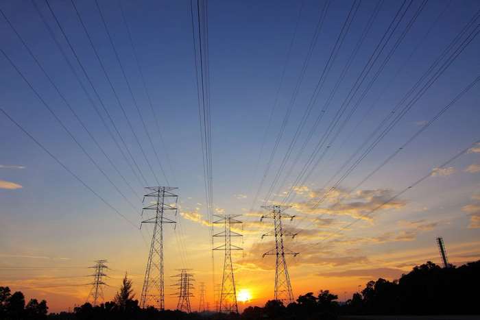 Power lines and towers at sunset