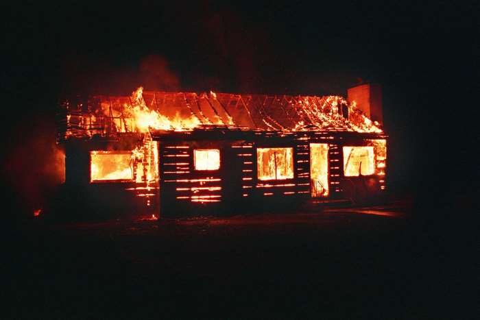 House on fire at night