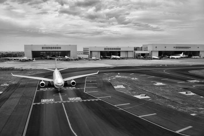 Airplanes at Evergreen Aviation hangars on a cloudy day