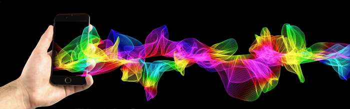 Hand holding smartphone with colorful abstract wave pattern