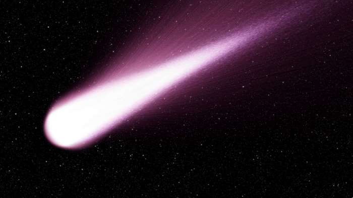 A bright comet with a purple tail in space