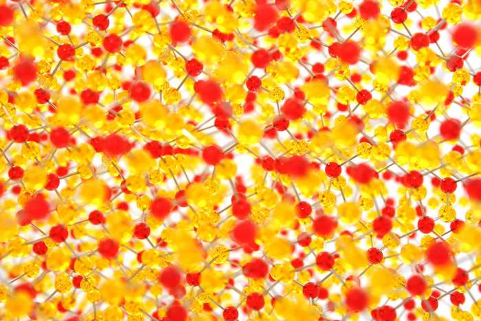 Red and yellow molecular structure with connecting lines