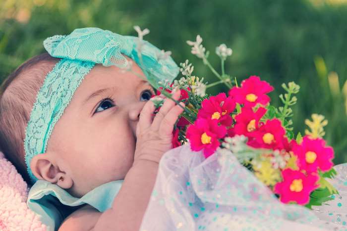 Baby girl with flowers and teal headband