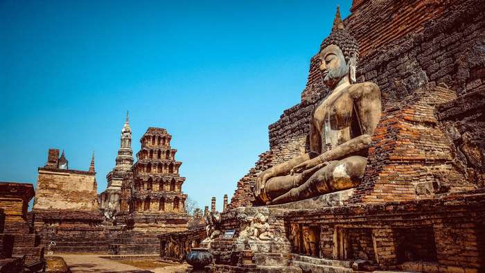 Ancient Buddha statue at a historic temple ruin