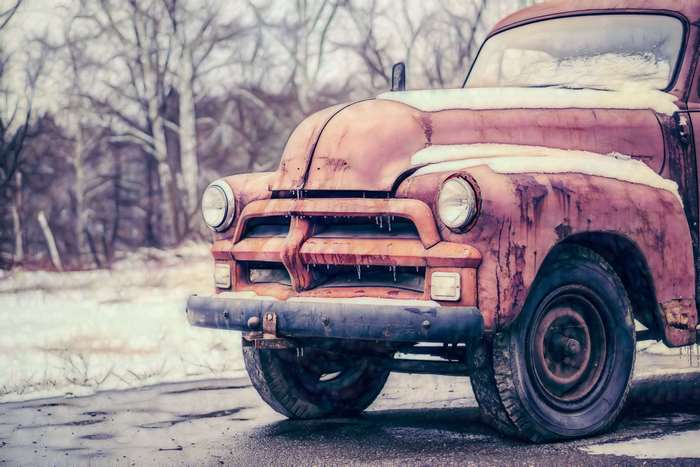 Rusty vintage American truck in winter