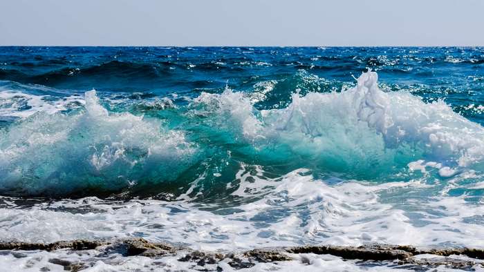 Crashing ocean wave with foam and spray