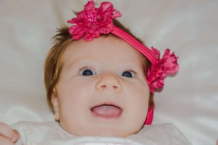 Baby girl with pink flower headband