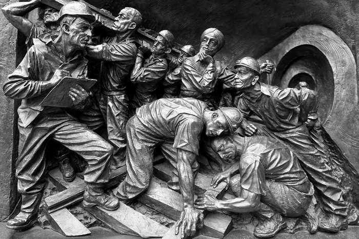 Sculpture of miners working in a tunnel