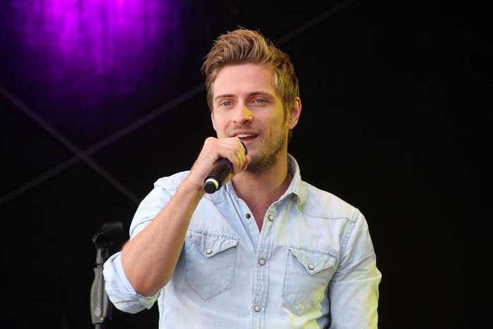 Man holding a microphone on stage