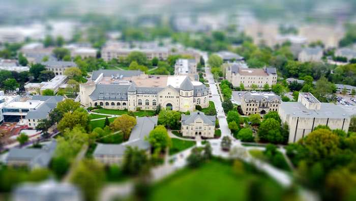 Aerial view of a university campus with buildings and trees