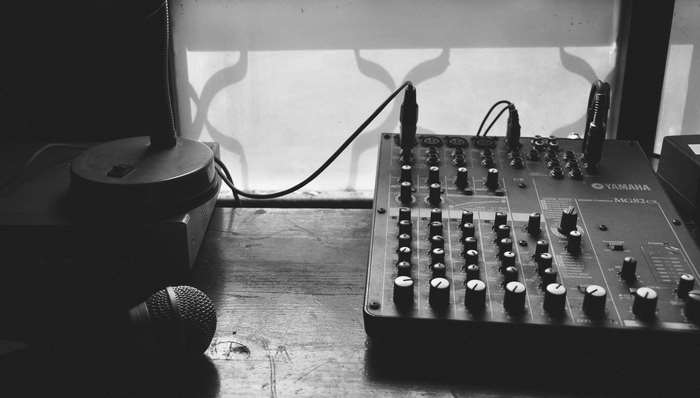 Yamaha sound mixer and microphones on a table