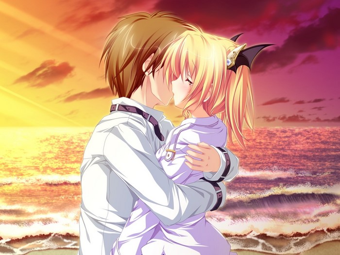 Nina Geminis and boy kissing on beach at sunset