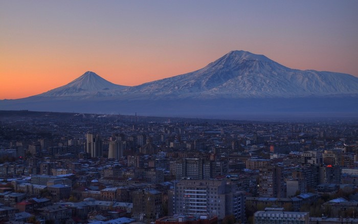 Mount Ararat and Yerevan cityscape at sunset