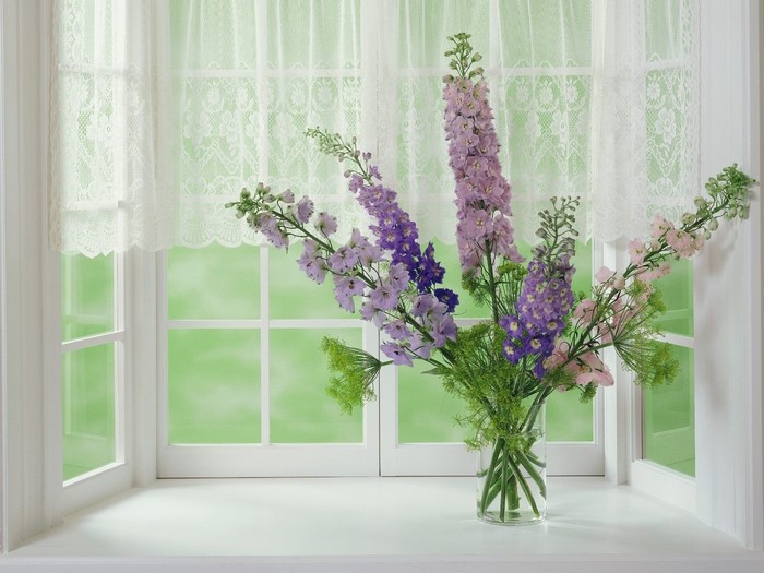 Flowers in a vase on a windowsill