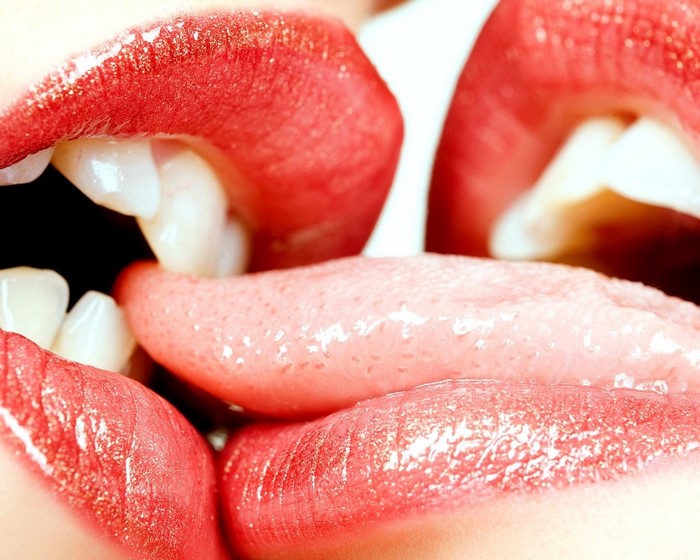 Close-up of Lips and Tongue Kissing