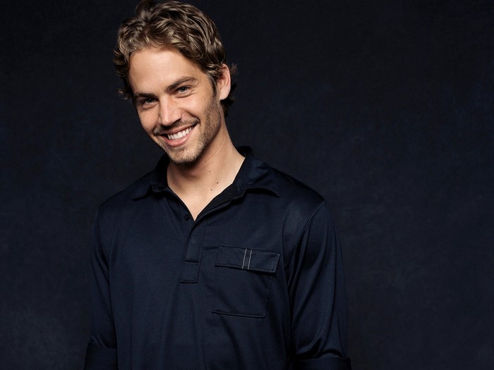 Paul Walker smiling in a dark shirt