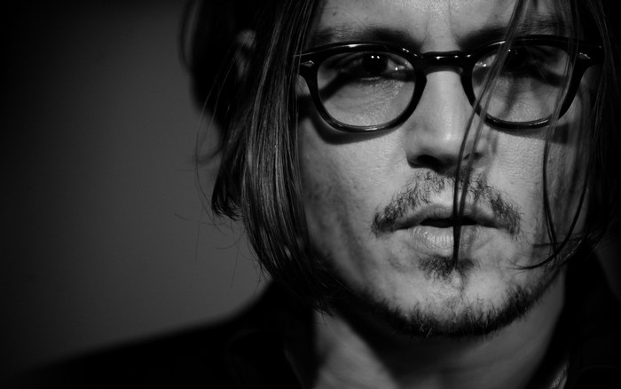 Johnny Depp wearing glasses and beard