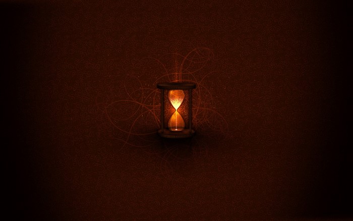 Hourglass with glowing sand on a patterned background