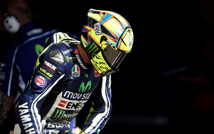 Valentino Rossi wearing AGV helmet and Yamaha racing suit