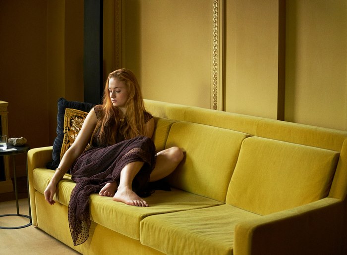 Sophie Turner Sitting on Yellow Couch