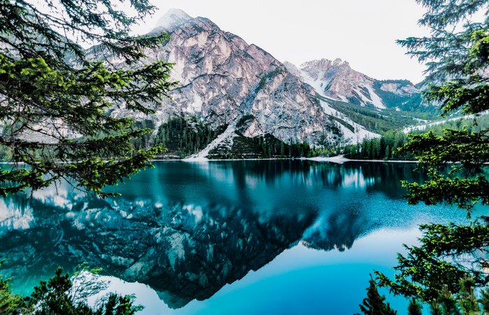 Mountain Lake Reflection with Snow and Trees