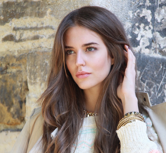 Model with long brown hair and jewelry