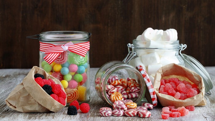 Assortment of candies and marshmallows in jars and bags