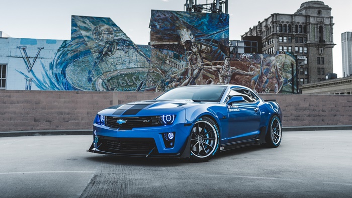 Blue Chevrolet Camaro ZL1 with Mural Background