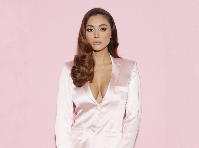 Lindsey Morgan in a pink satin blazer