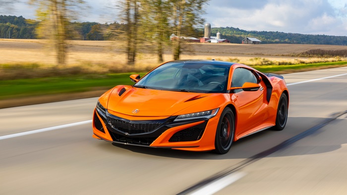 Orange Honda NSX Supercar Driving on a Road