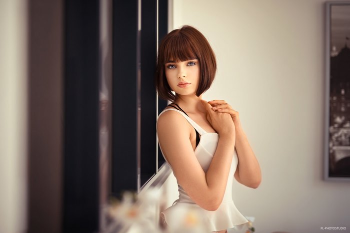 Marie Grippon with Short Brunette Hair and Blue Eyes