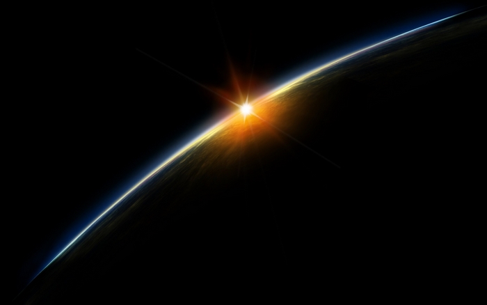 Sunrise over planet Earth from space