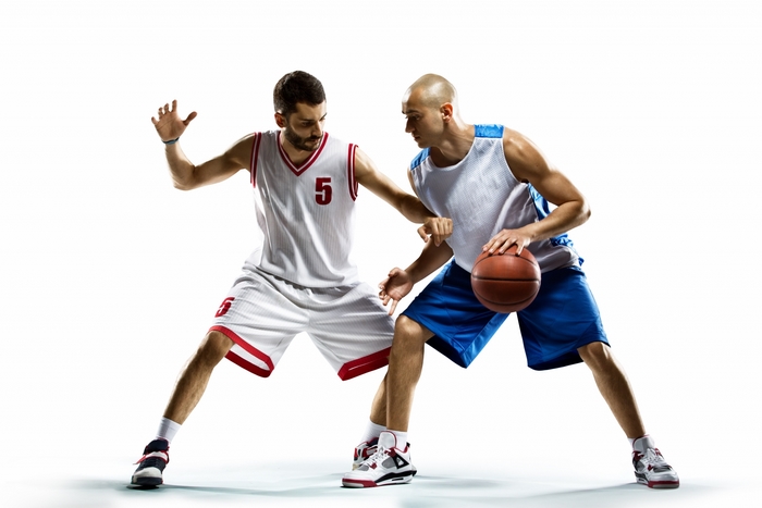 Two basketball players in action
