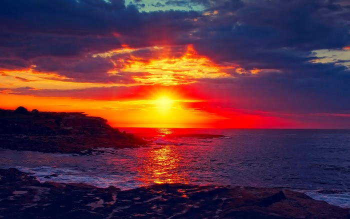 Sunset over rocky coast and ocean