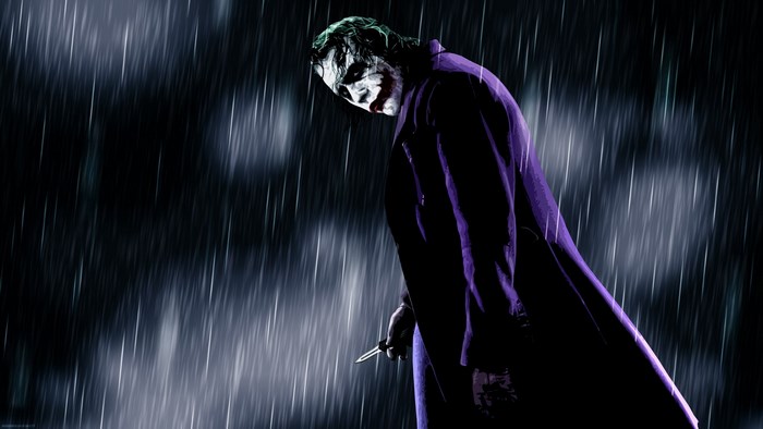Joker holding a knife in the rain