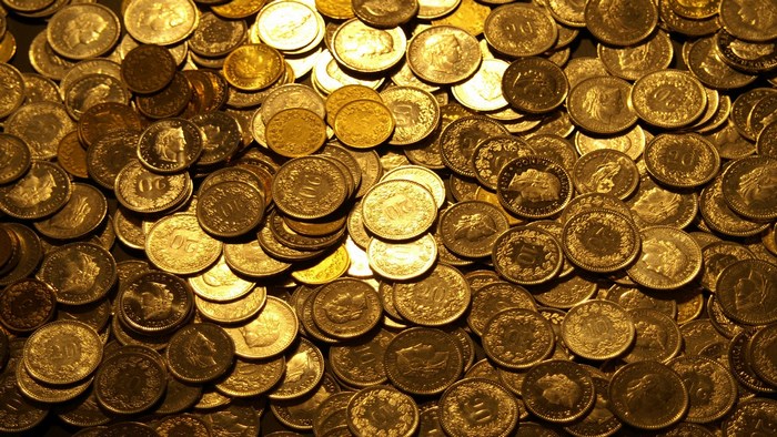 Pile of gold Swiss coins